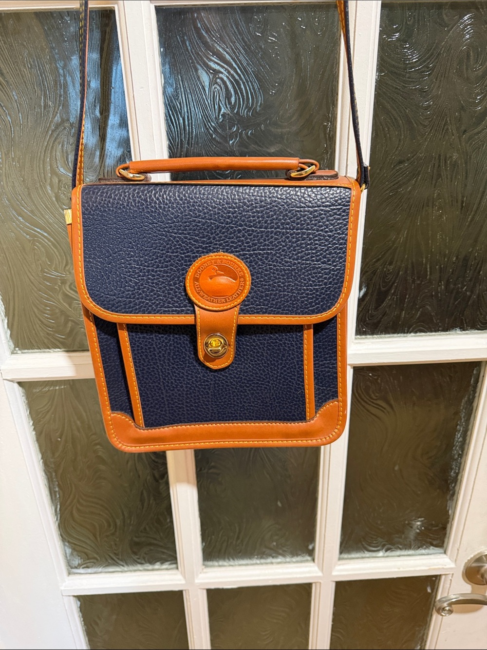 Dooney & Bourke Navy and Tan Pebbled Leather Crossbody